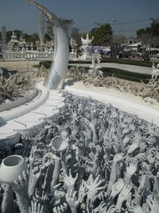 Hands reaching out at the White Temple