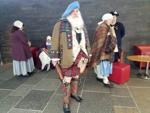 A clansman paying homage to his ancestors at Culloden Battlefield & Visitor Centre.